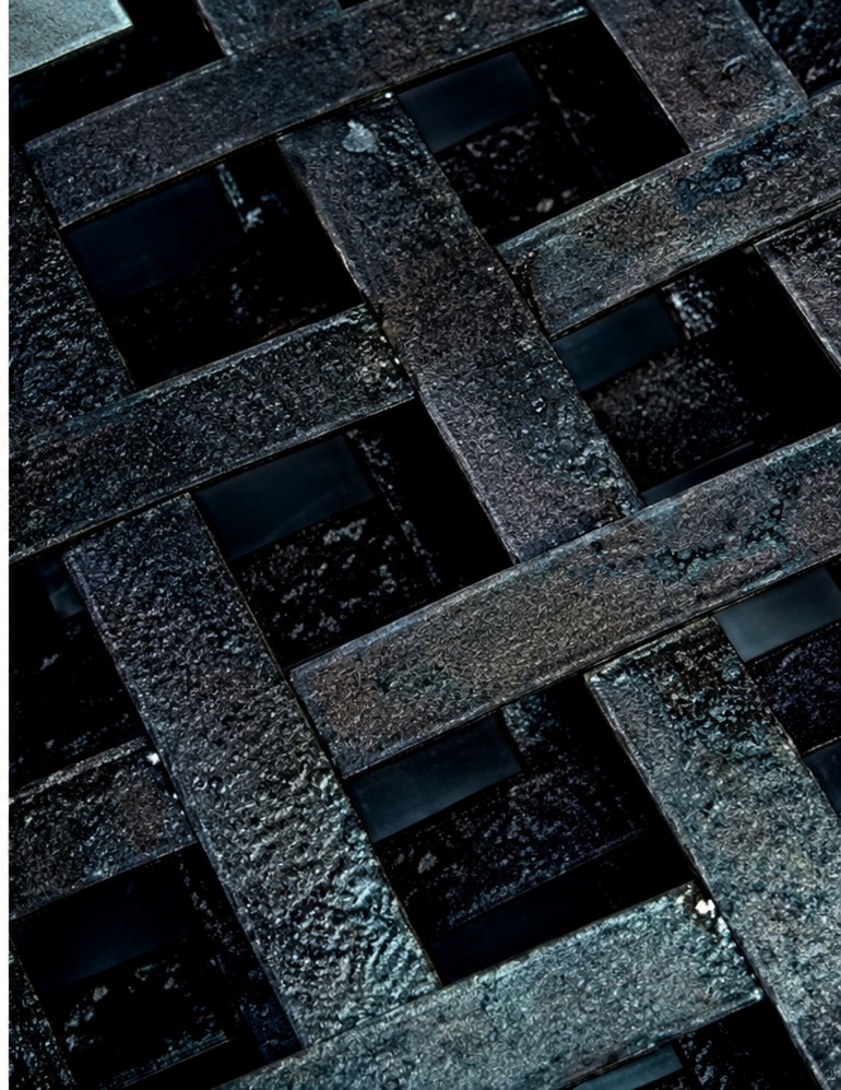The same steel grating with a stable dark paint-ready coating after treatment